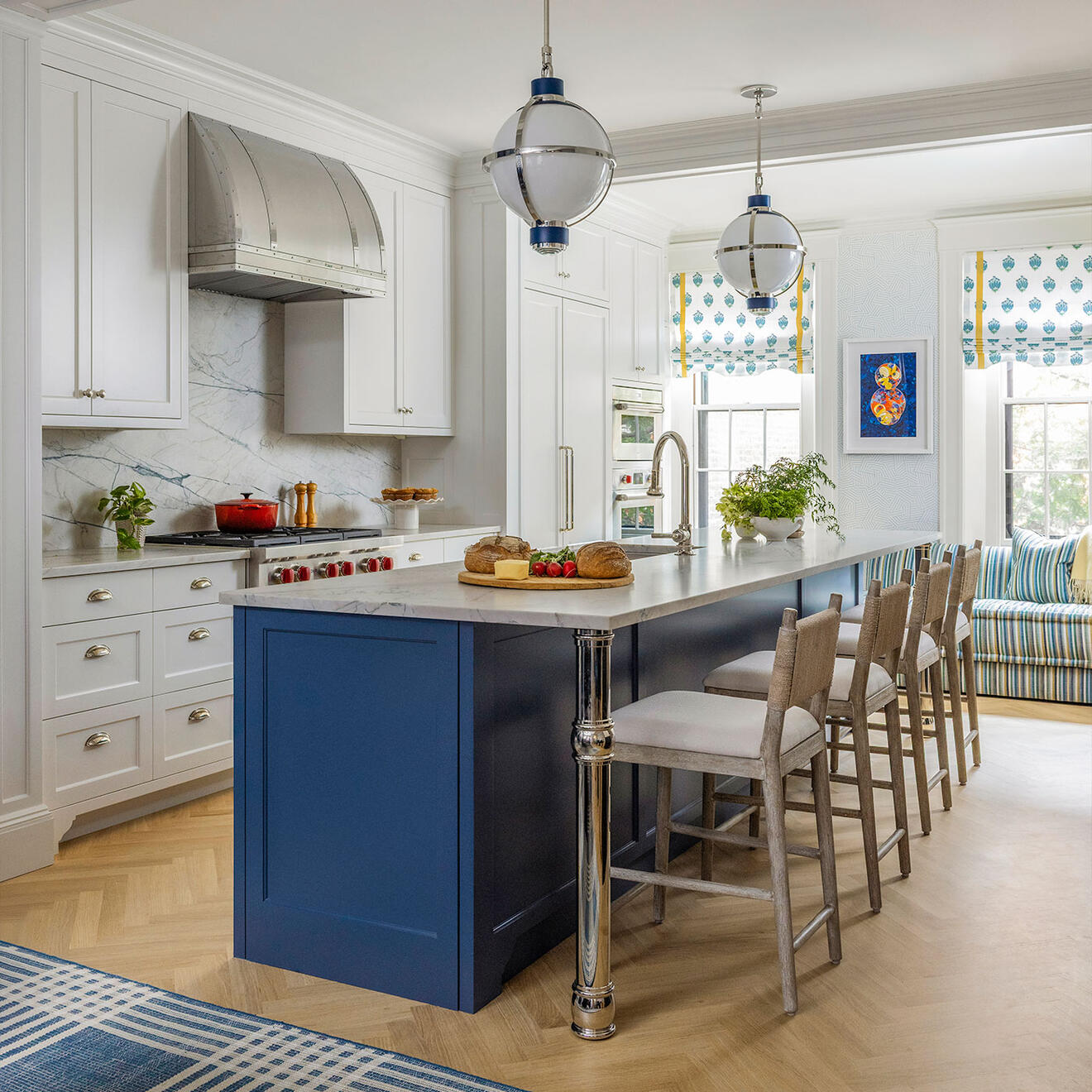 Myrtle Street Townhouse kitchen in Boston with custom white cabinetry, blue island, marble surfaces, and pendant lighting